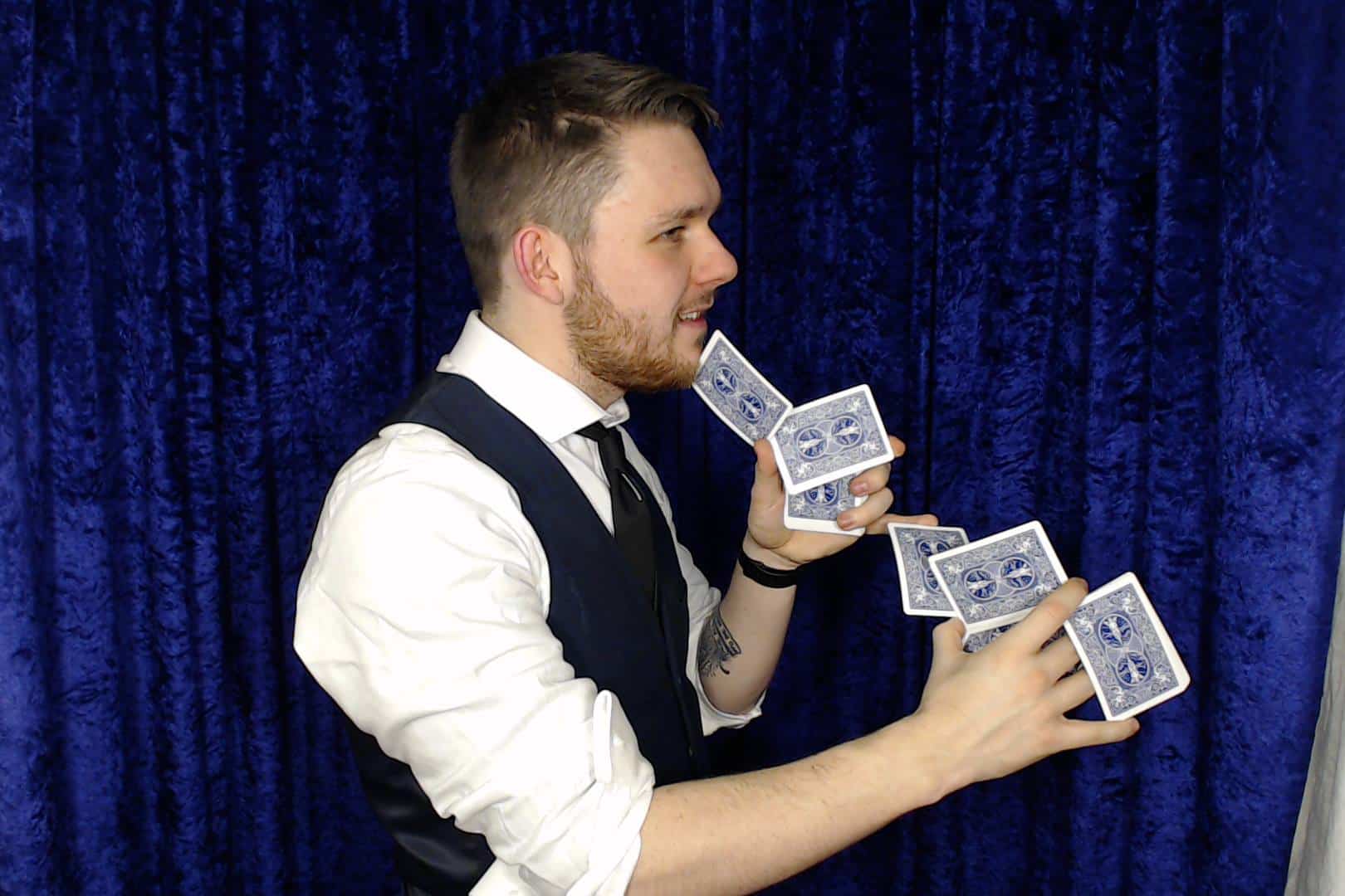 Professional Magician Showing Off With Cards In A PhotoBooth from Christmas Event!