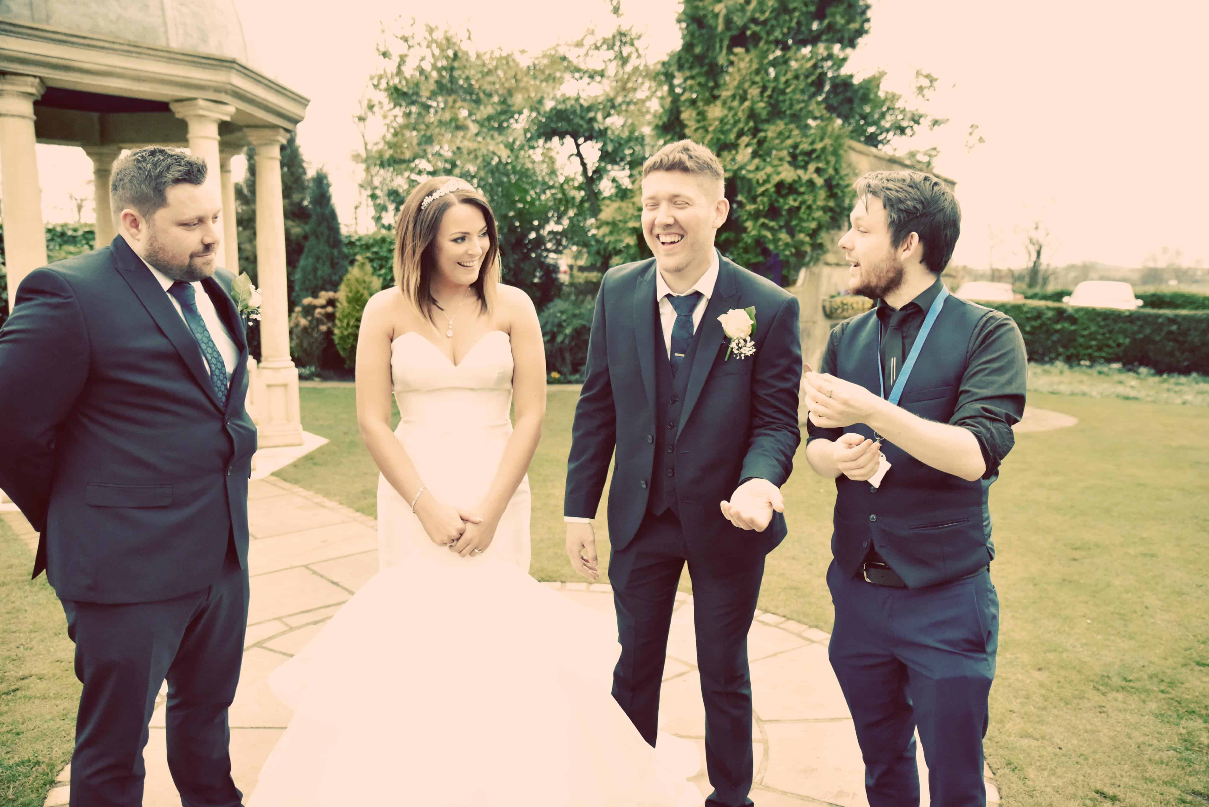 Professional magician Greg Holroyd performing pickpocket magic for wedding guests