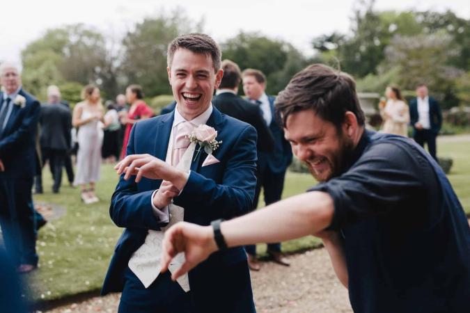 Wedding guest laughing after magician Greg Holroyd reveals he stole his watch during the trick in UK.